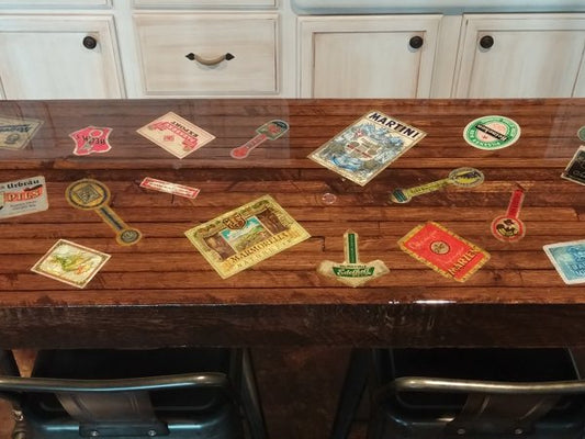 An epoxy table top with a layer of paper embedments.