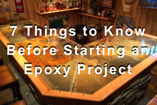 A blurred photo of an epoxy bar top with a text overlay that says "7 Things to Know Before Starting an Epoxy Project"