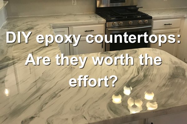 A photo featuring a set of epoxy kitchen countertops with a marble-like finish. Overlaid is text that says "DIY epoxy countertops: Are they worth the effort?"