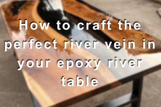 A blurred photo of a wooden epoxy river table with an opaque black-tinted river vein.