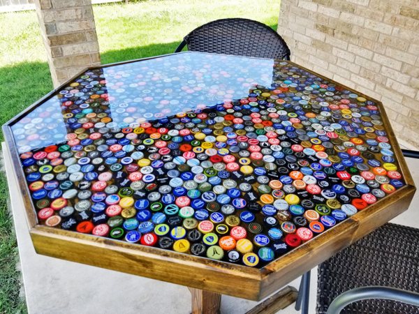 A bottle cap epoxy table top with a pristine epoxy finish.